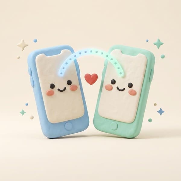 Two smiling clay phones leaning toward each other, linked by a glowing dotted arc with a heart, representing device pairing